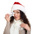 Beautiful girl portrait dressed in santa hat show big snowflake toy. White isolated background. New year eve and winter holiday co Royalty Free Stock Photo