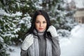 Beautiful girl portrait outdoor in a winter with snow