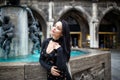 Beautiful girl portrait on the street in black dress