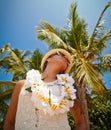 Beautiful girl posing on the beach in the hot sun, outdoor portrait Royalty Free Stock Photo