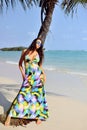 Beautiful girl posing on the beach in hot sun, outdoor portrait Royalty Free Stock Photo