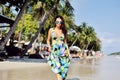 Beautiful girl posing on the beach in hot sun, outdoor portrait Royalty Free Stock Photo