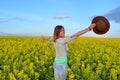 Beautiful girl posing in a field of yellow flowers Royalty Free Stock Photo