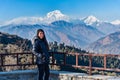 Beautiful girl posing infront of Dhaulagiri mountain range, Pokhara, Nepal