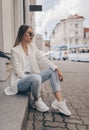 Beautiful girl posing in the street. Fashion summer photo