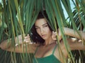 Beautiful girl posing in tropical forest. Close-up perfect portrait Royalty Free Stock Photo