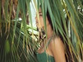 Beautiful girl posing in tropical forest. Close-up perfect portrait Royalty Free Stock Photo