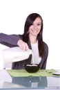 Beautiful Girl Pouring Milk to her Cereal Royalty Free Stock Photo