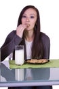 Beautiful Girl Pouring Milk to her Glass Royalty Free Stock Photo