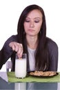 Beautiful Girl Pouring Milk to her Glass Royalty Free Stock Photo