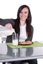 Beautiful Girl Pouring Milk to her Glass Royalty Free Stock Photo