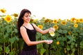 Beautiful girl pours sunflower oil from the jug Royalty Free Stock Photo