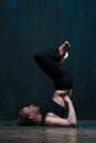 Beautiful girl practicing advanced yoga in class Royalty Free Stock Photo