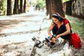 Beautiful girl is prepairing for rollerblading at the street Royalty Free Stock Photo