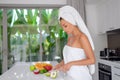Beautiful girl preparing a healthy breakfast of fruit in the morning Royalty Free Stock Photo
