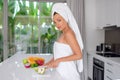 Beautiful girl preparing a healthy breakfast of fruit in the morning Royalty Free Stock Photo