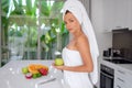 Beautiful girl preparing a healthy breakfast of fruit in the morning Royalty Free Stock Photo