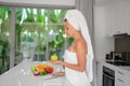 Beautiful girl preparing a healthy breakfast of fruit in the morning Royalty Free Stock Photo