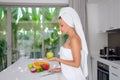 Beautiful girl preparing a healthy breakfast of fruit in the morning Royalty Free Stock Photo