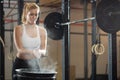 Beautiful girl preparing to weightlifting at fitness center Royalty Free Stock Photo