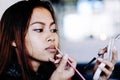 Beautiful girl putting makeup Royalty Free Stock Photo