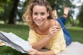 beautiful girl reading book in summer park Royalty Free Stock Photo