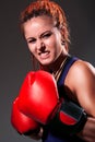 Beautiful girl with red boxing gloves, dreadlocks Royalty Free Stock Photo