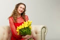 Beautiful girl in red dress with tulip flowers Royalty Free Stock Photo