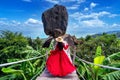 Beautiful girl in red dress walking at overlap stone at Koh Samui, Thailand Royalty Free Stock Photo