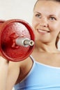 Beautiful girl and red dumbbell Royalty Free Stock Photo