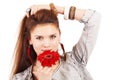 Beautiful girl with red flower near lips Royalty Free Stock Photo