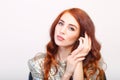 Beautiful girl with red hair and shiny dres Royalty Free Stock Photo