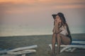 Beautiful girl relaxing, beach lounge and natural background. Happy vacation Royalty Free Stock Photo