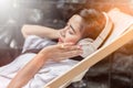 Beautiful girl relaxing pool side beauty concept.happy girl smile and listen to music with headphones Royalty Free Stock Photo