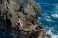 Beautiful girl resting in natural ocean swimming pool