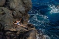 Beautiful girl resting in natural ocean swimming pool