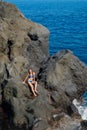 Beautiful girl resting in natural ocean swimming pool