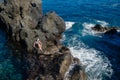 Beautiful girl resting in natural ocean swimming pool