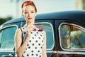 Beautiful girl in retro style and a vintage car Royalty Free Stock Photo