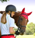 Beautiful girl rider interacting with her horse