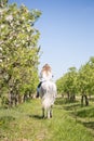 Beautiful girl riding a horse on a white horse in the garden Royalty Free Stock Photo