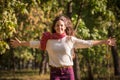 Beautiful girl running on autumn park Royalty Free Stock Photo