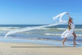 Beautiful girl running on the beach Royalty Free Stock Photo