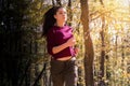 Beautiful girl running trough forest in autumn Royalty Free Stock Photo