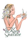 A beautiful girl`s face with blond hair decorated with flowers and butterflies with a lettering design about nature.