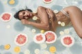 Beautiful Girl`s Portrait In Pool With Citrus. Woman In Bikini Enjoying Sunny Day At SPA Resort. Royalty Free Stock Photo