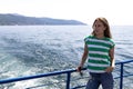 A beautiful girl is sailing on a ship on lake Baikal