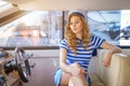 Beautiful girl sailor on a yacht at the helm Royalty Free Stock Photo