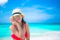 Beautiful girl with seashell in hands at tropical beach Royalty Free Stock Photo