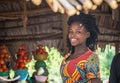 Beautiful girl sells fruit in a market in Uganda